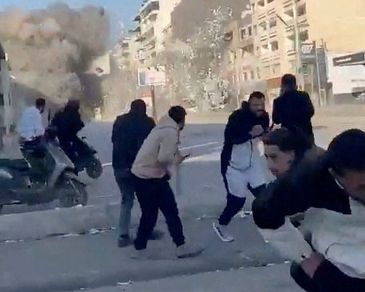 People run as a missile hits a building, following an escalation between Hezbollah and Israel amid the U.S.-Israel conflict with Iran, in Tyre, Lebanon, in this screen grab obtained from a social media video released March 2, 2026. Social Media/via REUTERS  THIS IMAGE HAS BEEN SUPPLIED BY A THIRD PARTY. MANDATORY CREDIT. NO RESALES. NO ARCHIVES. 

Verification: 
-Buildings, shopfronts, road layout and petrol station matched file and satellite imagery
-Exact time could not be verified
-However, Israel said it launched a wave of strikes in southern Lebanon on Monday (March 2)
-No older versions of the video found before Monday (March 2)